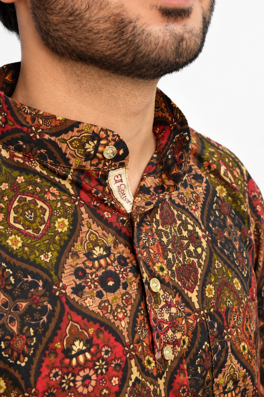 An artisan hand-embroidering Dharniya; the film advances as you scroll